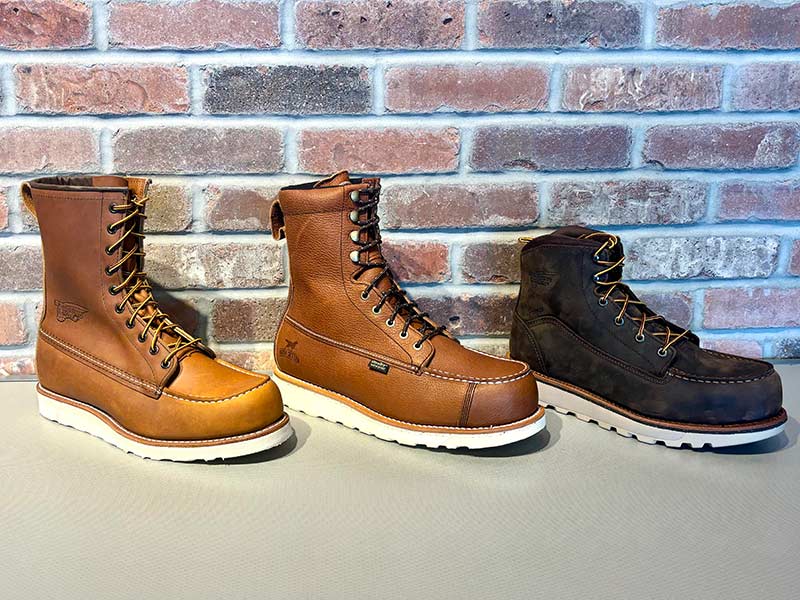 Three boots arranged on a table